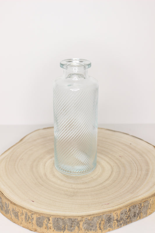 Botellita flores relieve